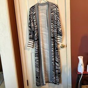 Stylish Zebra Print kimono. Medium weight quality material brand new never worn.